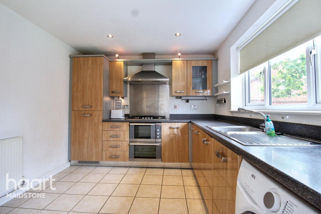 Before: kitchen used to compare RoomStage and ReimagineHome virtual staging